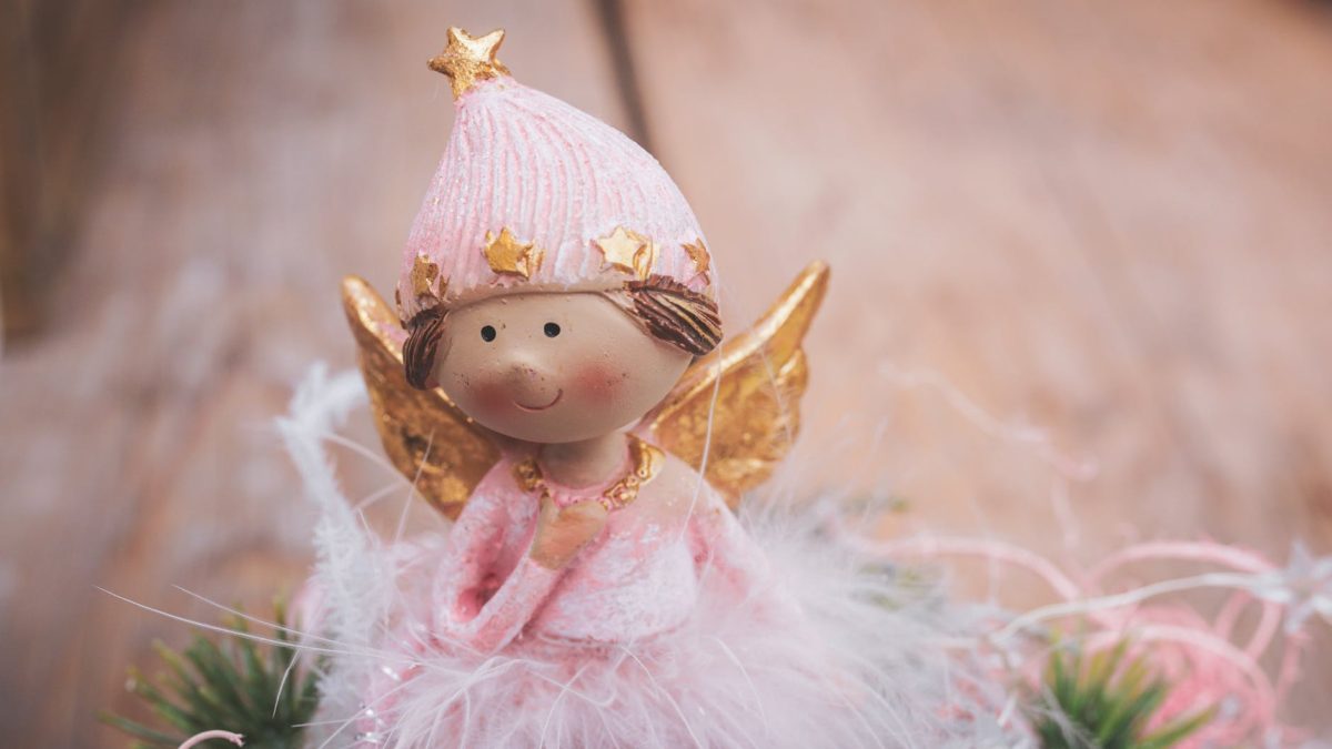 selective focus photography of angel ornament