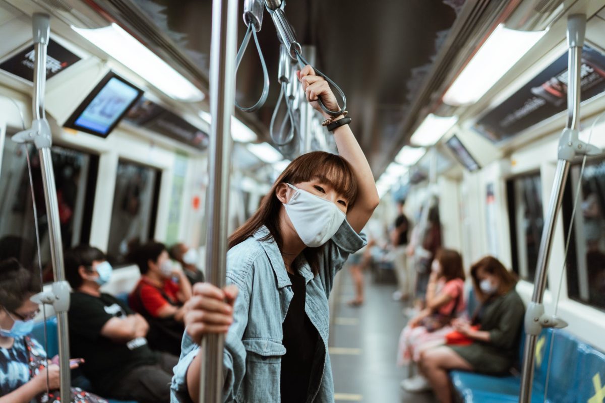 woman wearing a face mask on the subway