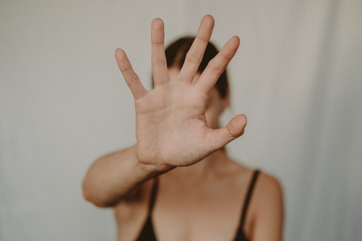 woman showing stop gesture with hand